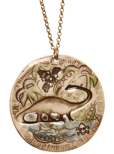 Dinosaur with rainbow medallion by Iggy & Lou Lou Dinosaur with rainbow medallion by Iggy & Lou Lou