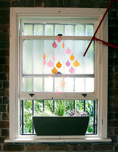 Printed Polypropylene Scales mobile hanging above the Polli herb garden Printed Polypropylene Scales mobile hanging above the Polli herb garden